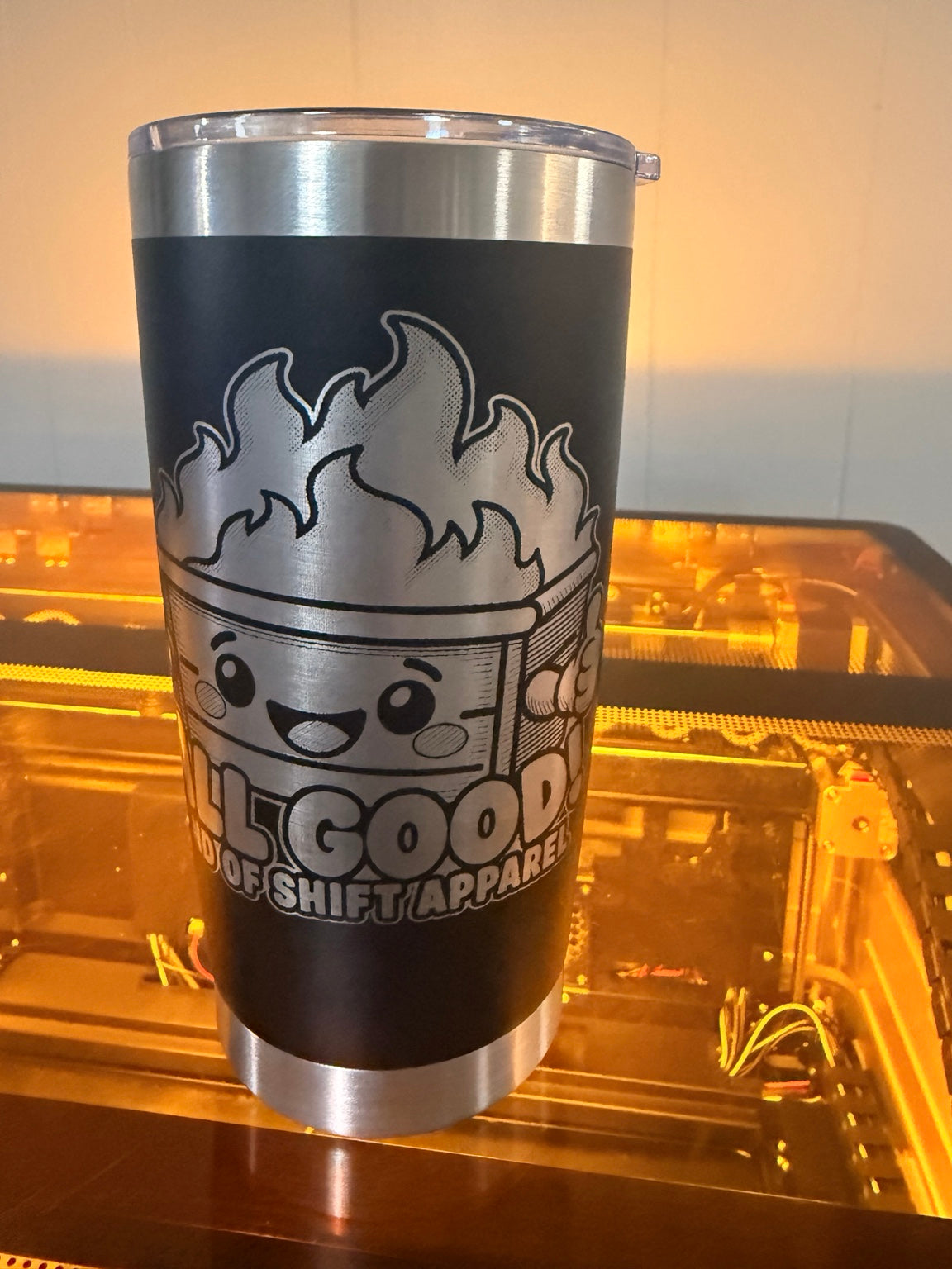 Actual black All Good dumpster fire tumbler laser engraved by End of Shift Apparel